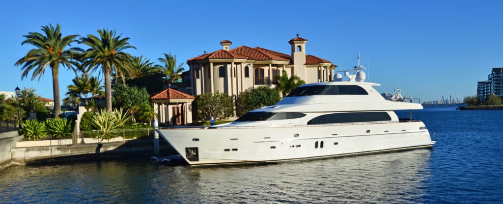 Luxury waterfront home on the Gold Coast with a super yacht moored out front