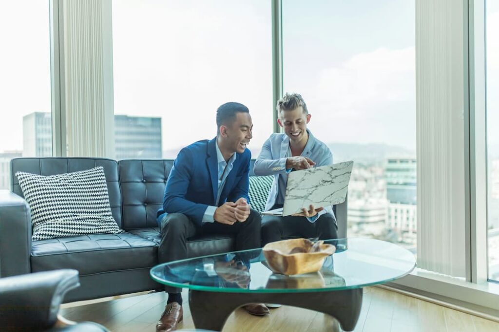 buyers-advocate-cost Photo by Austin Distel c/o Unsplash No changes made https://unsplash.com/photos/two-men-in-suit-sitting-on-sofa-jpHw8ndwJ_Q?utm_content=creditShareLink&utm_medium=referral&utm_source=unsplash