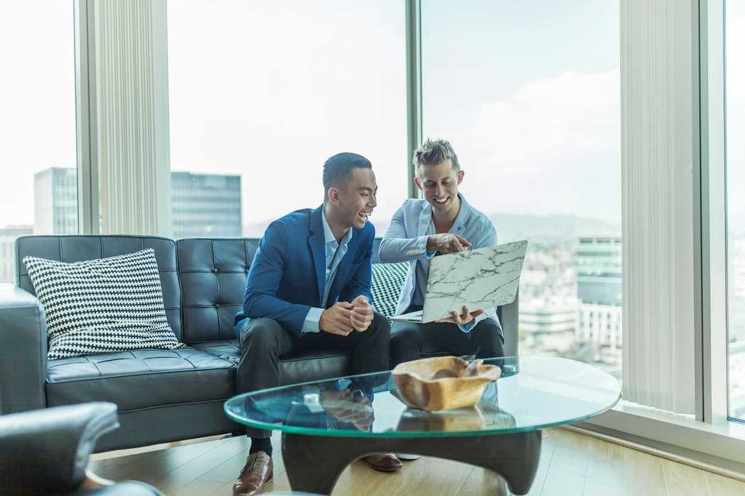 buyers-advocate-cost Photo by Austin Distel c/o Unsplash No changes made https://unsplash.com/photos/two-men-in-suit-sitting-on-sofa-jpHw8ndwJ_Q?utm_content=creditShareLink&utm_medium=referral&utm_source=unsplash